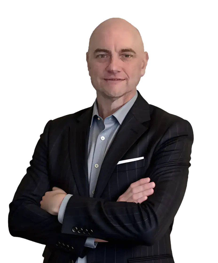 Image of a bald man wearing a grey suit and hands are folded.